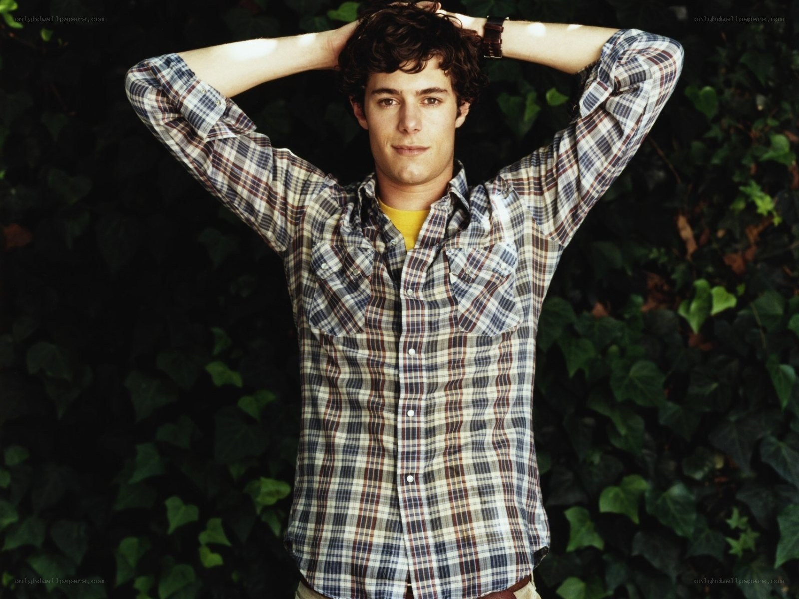 man in plaid shirt outdoors