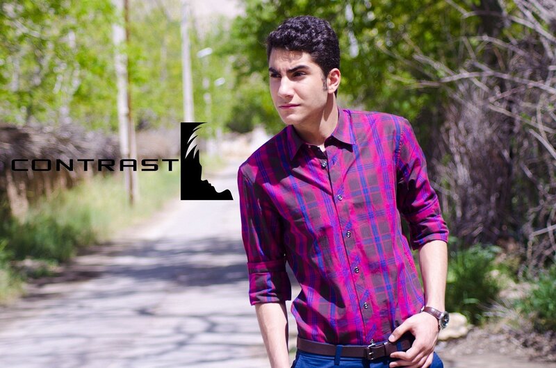 man in plaid shirt outdoors