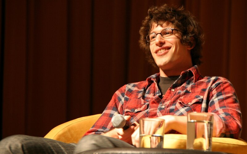 man in plaid shirt smiling