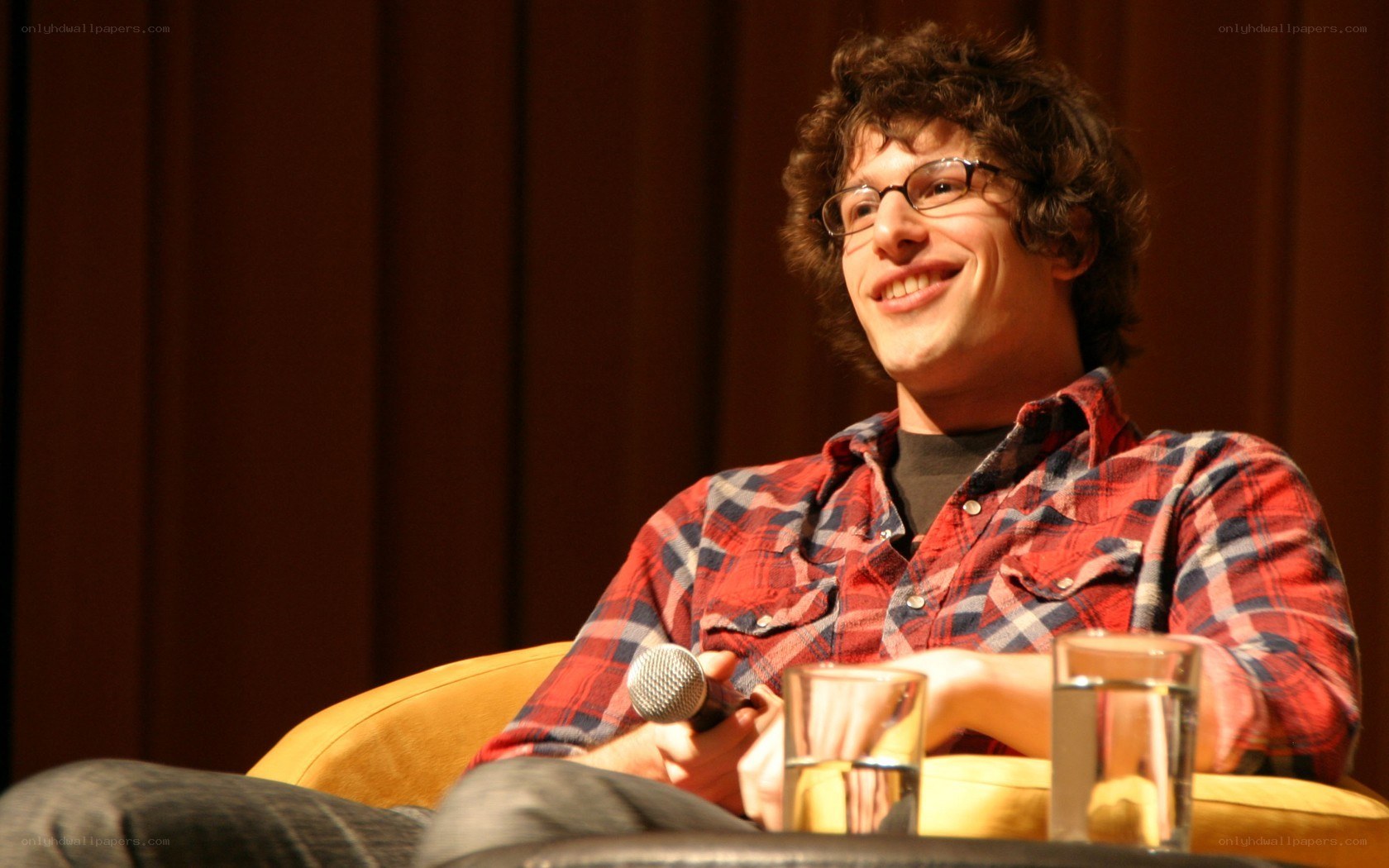 man in plaid shirt smiling