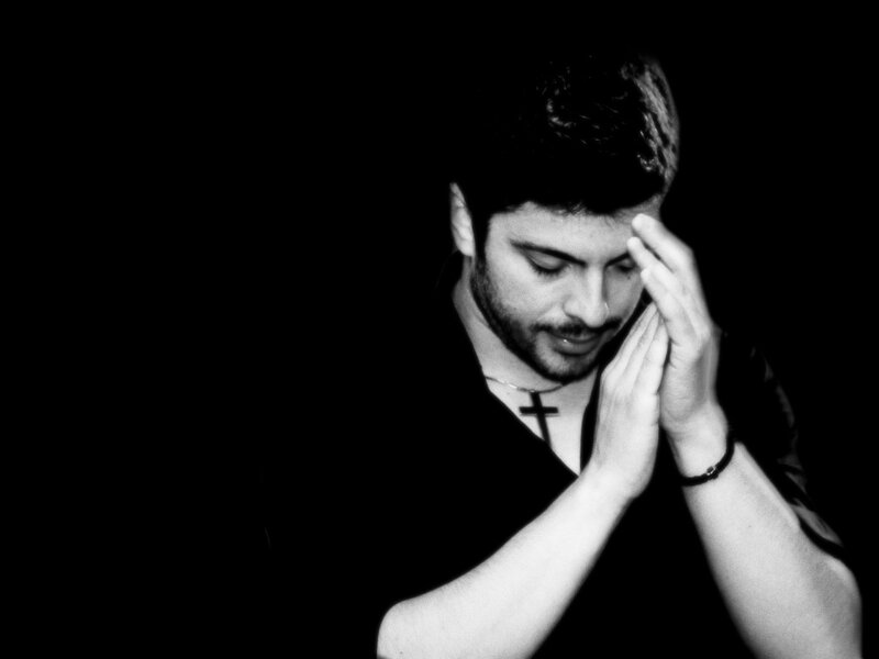 man in prayer pose