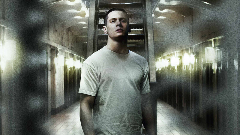 man in prison corridor