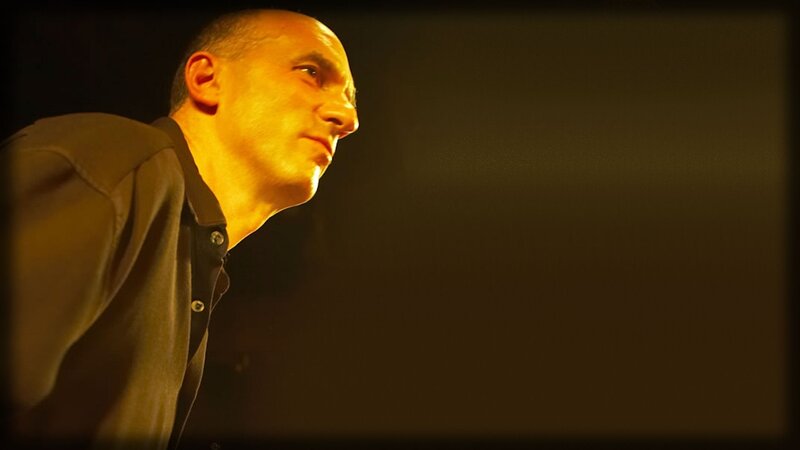 man in profile under warm light