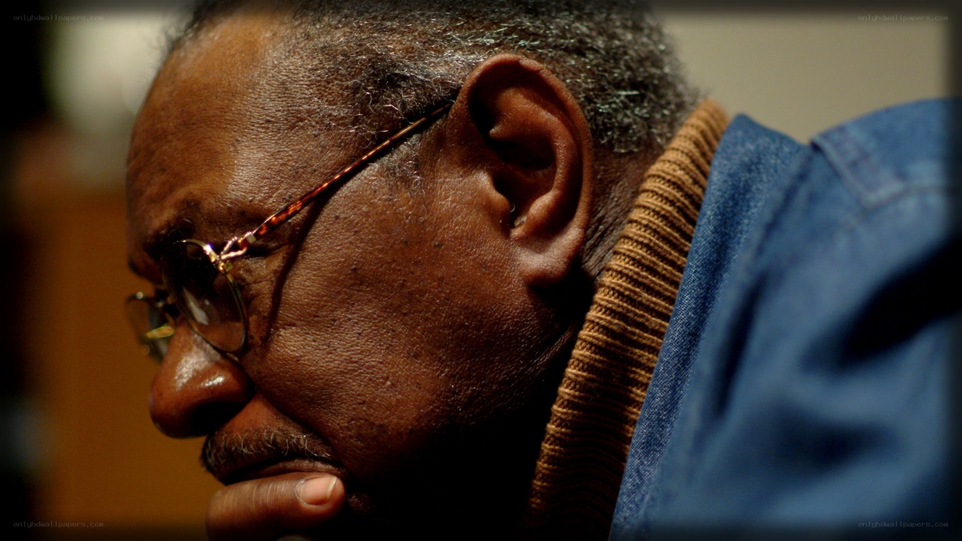 man in profile wearing glasses