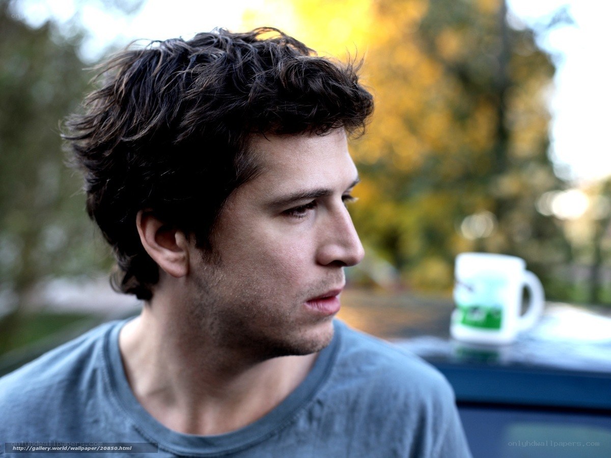 man in profile with mug