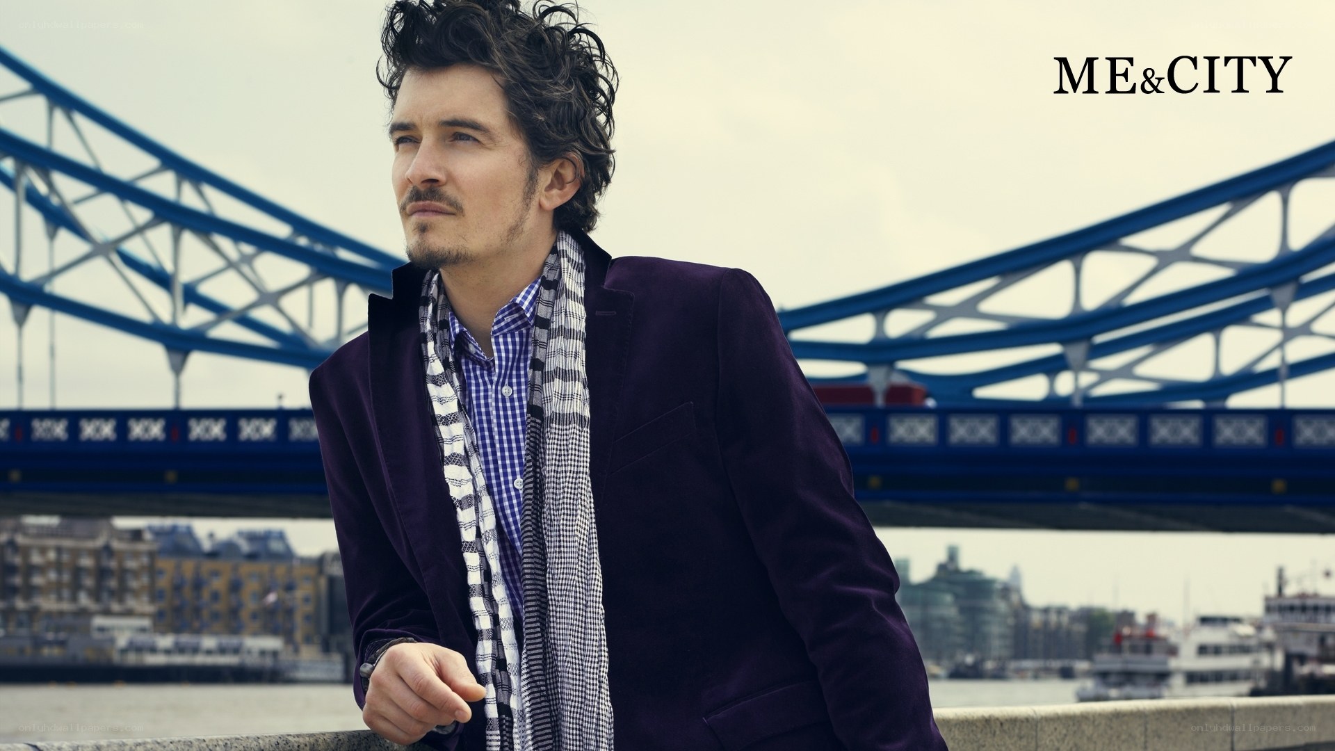 man in purple jacket by tower bridge