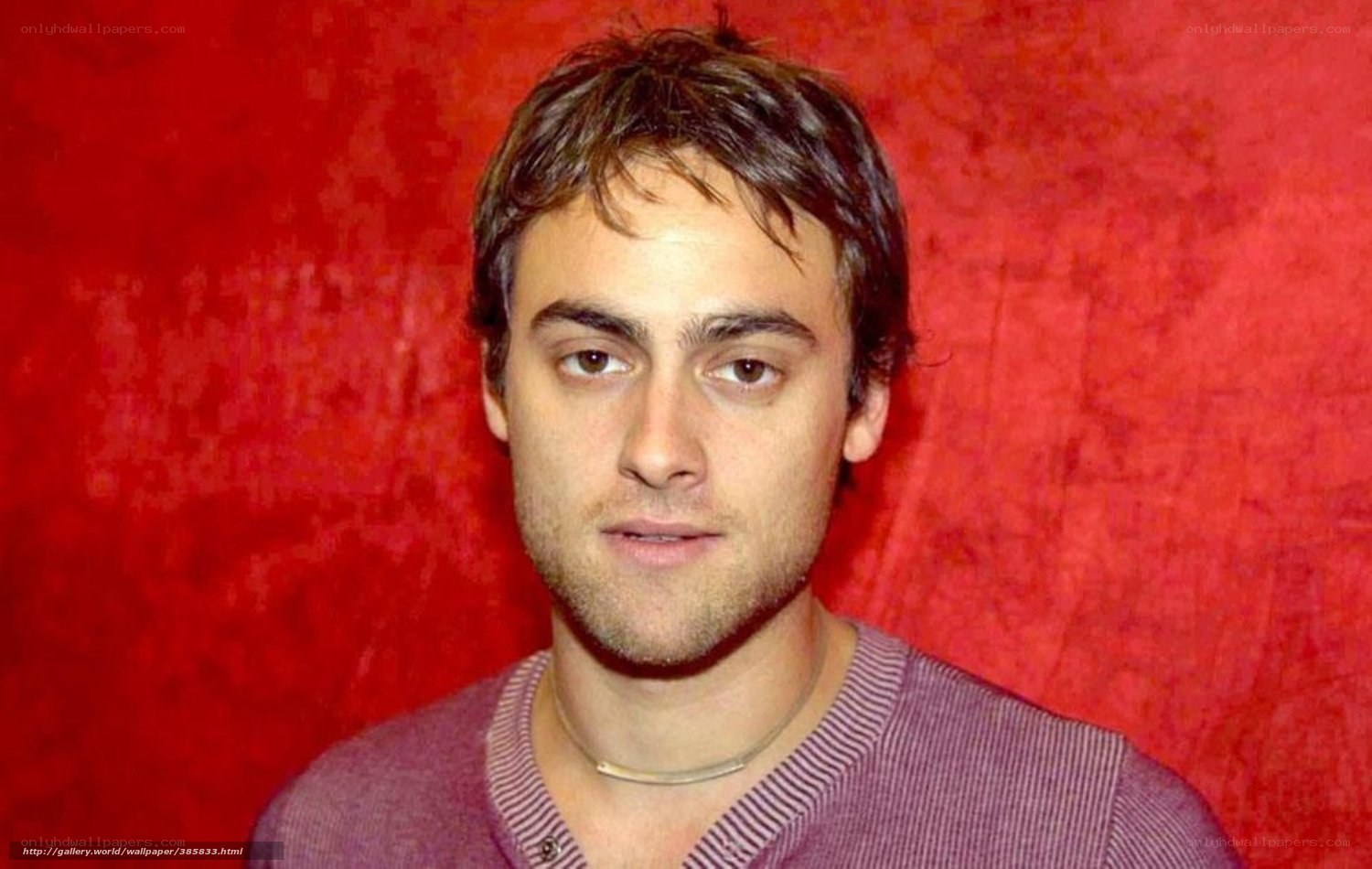 man in purple shirt