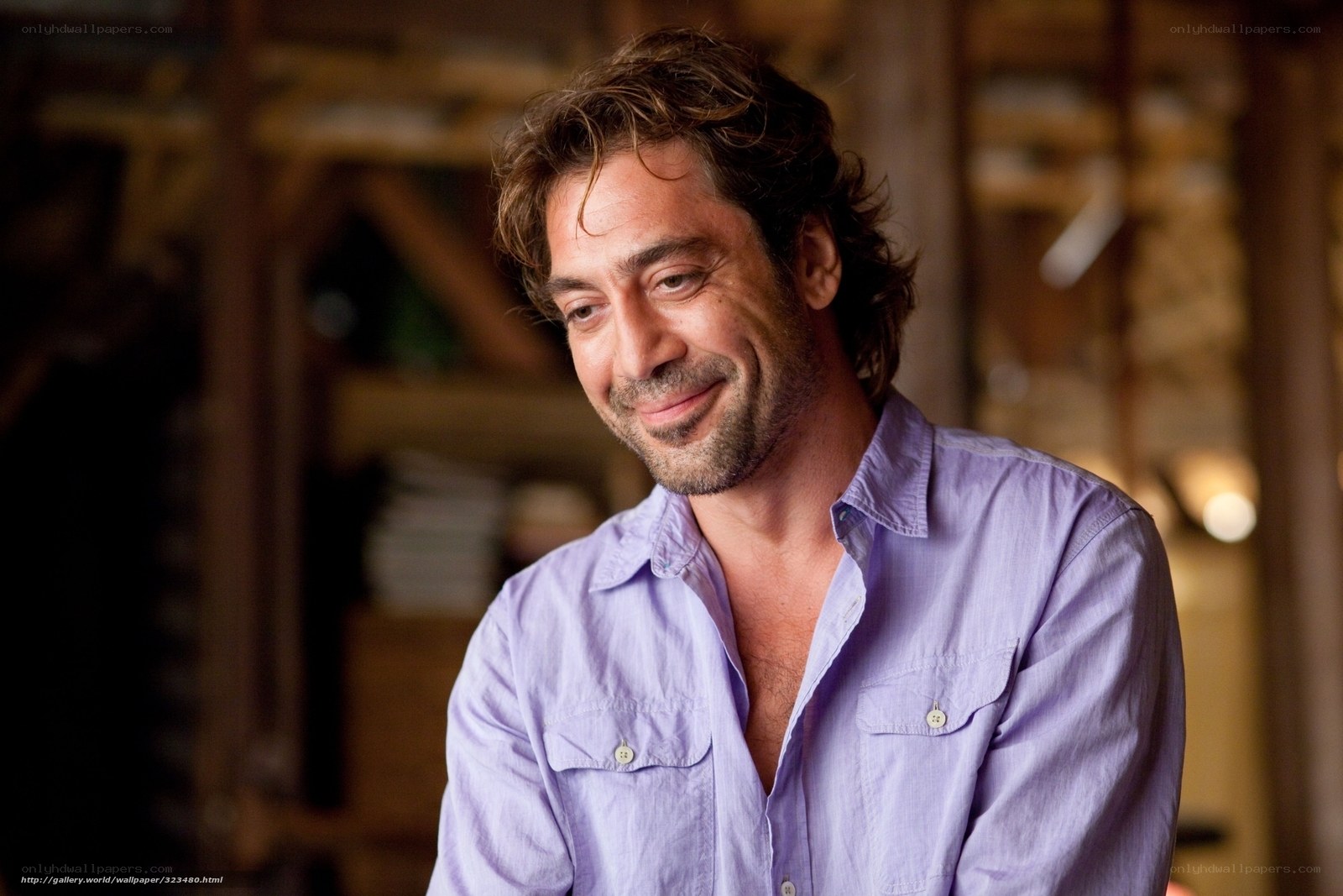 man in purple shirt smiling