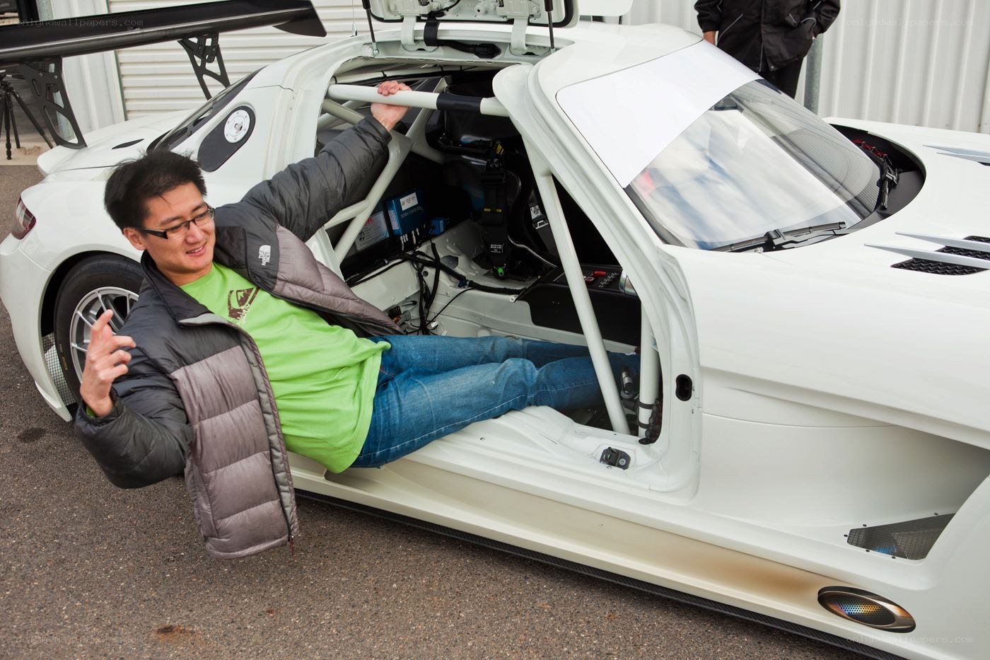 Man in race car cockpit