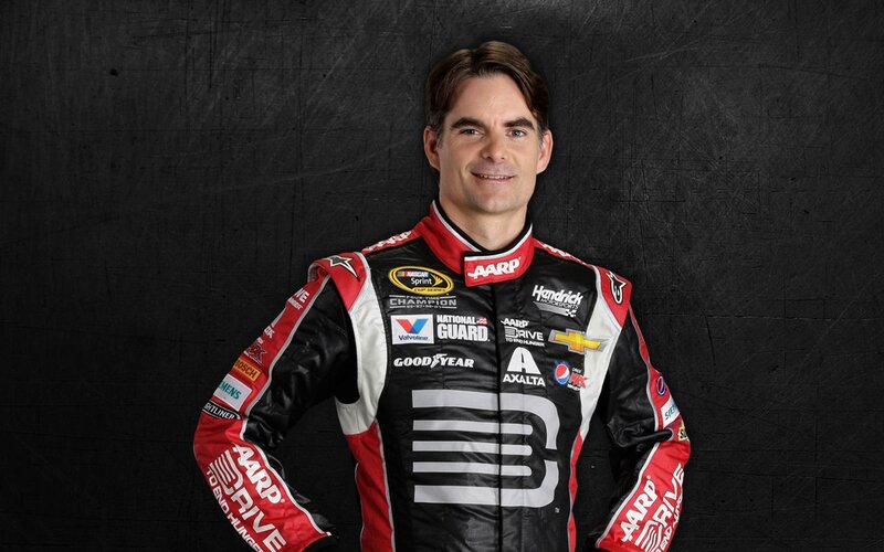 Man in Racing Suit — Black, Confident