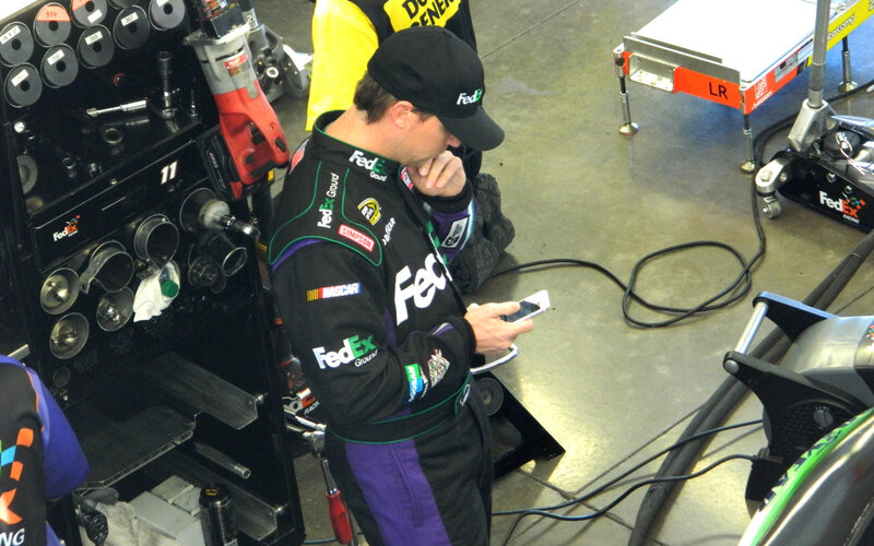 Man in Racing Suit — Black, Focused