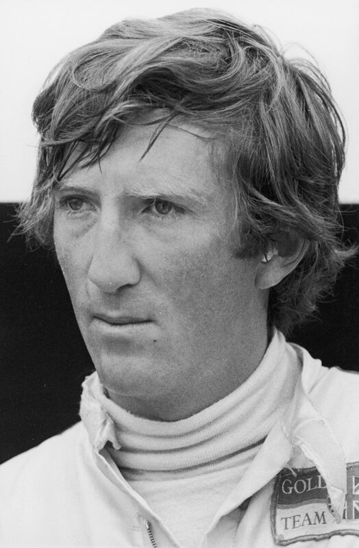 Man in Racing Suit — Black, Serious, Photograph, Racing Suit