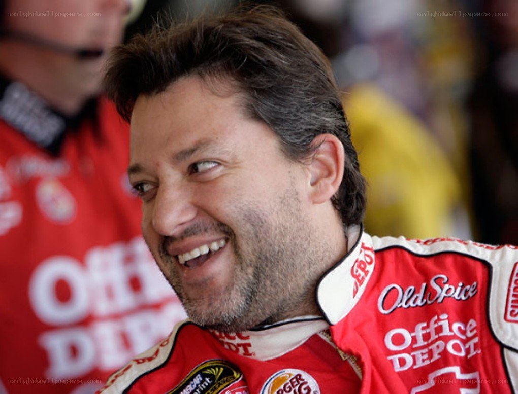 man in racing suit smiling
