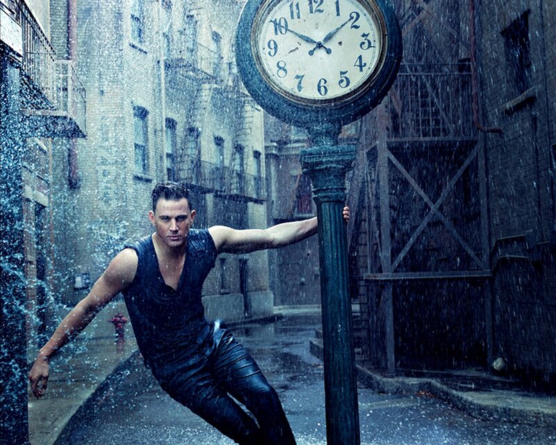 Man in Rain Holding Clock