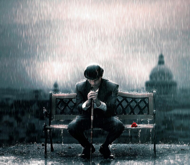 Man in Rain on Bench