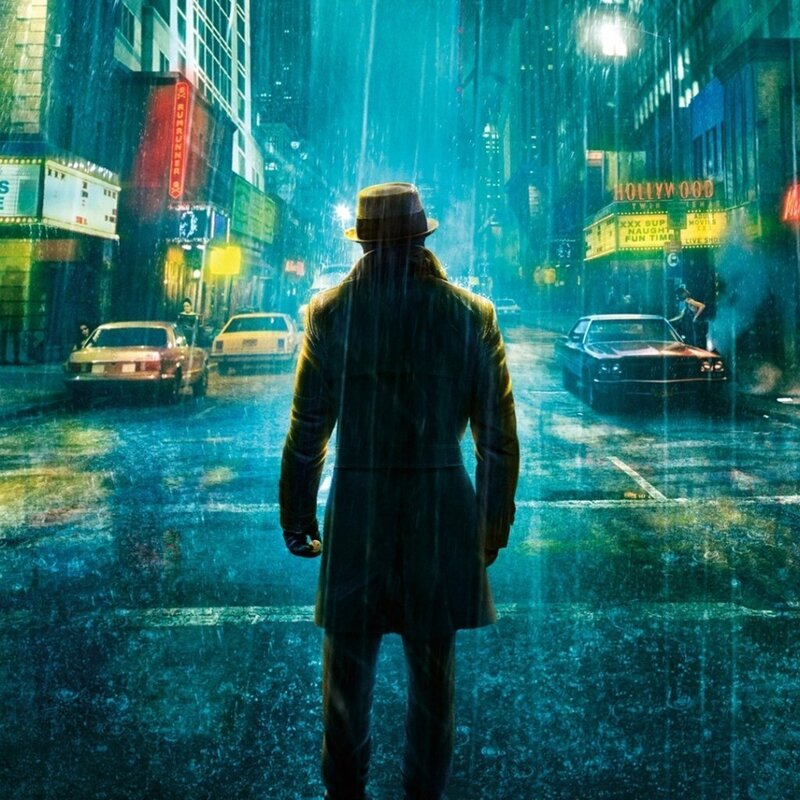 Man in rain on city street