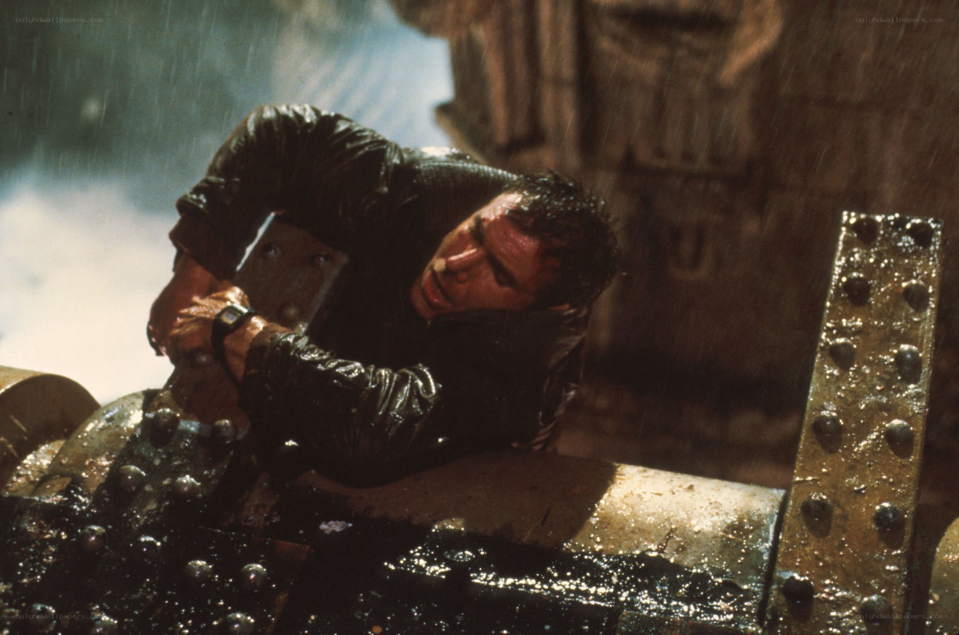 Man in rain on metal structure