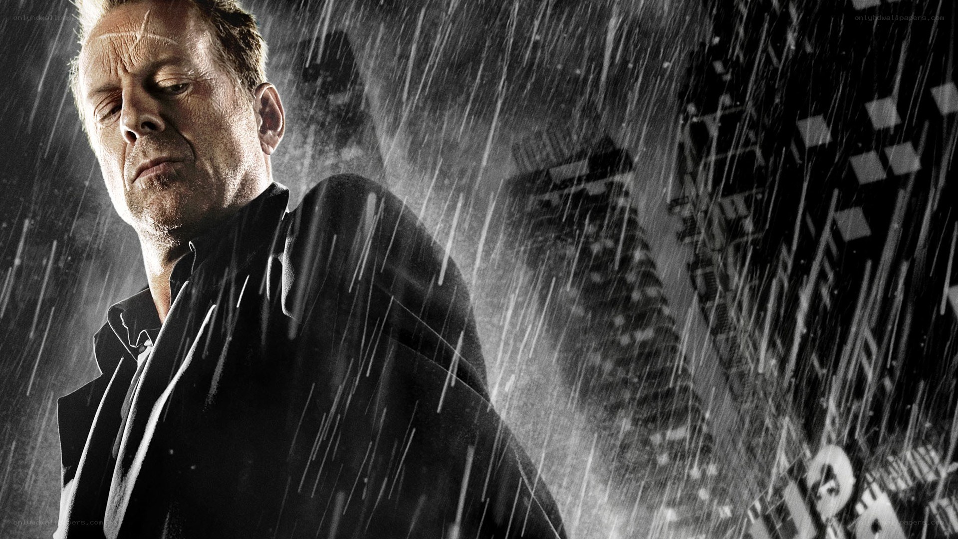 man in rain with city background
