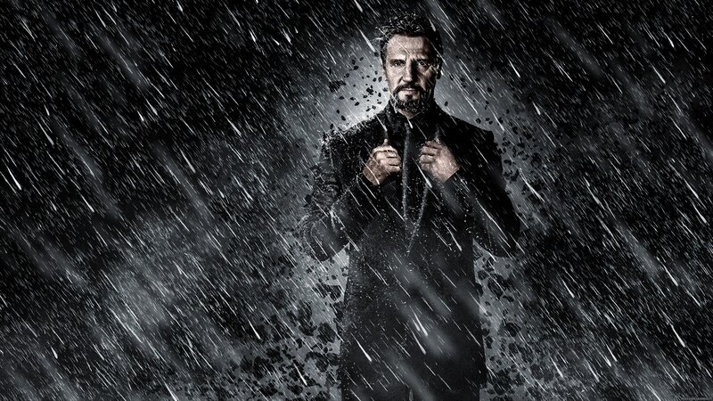 man in rain with coat