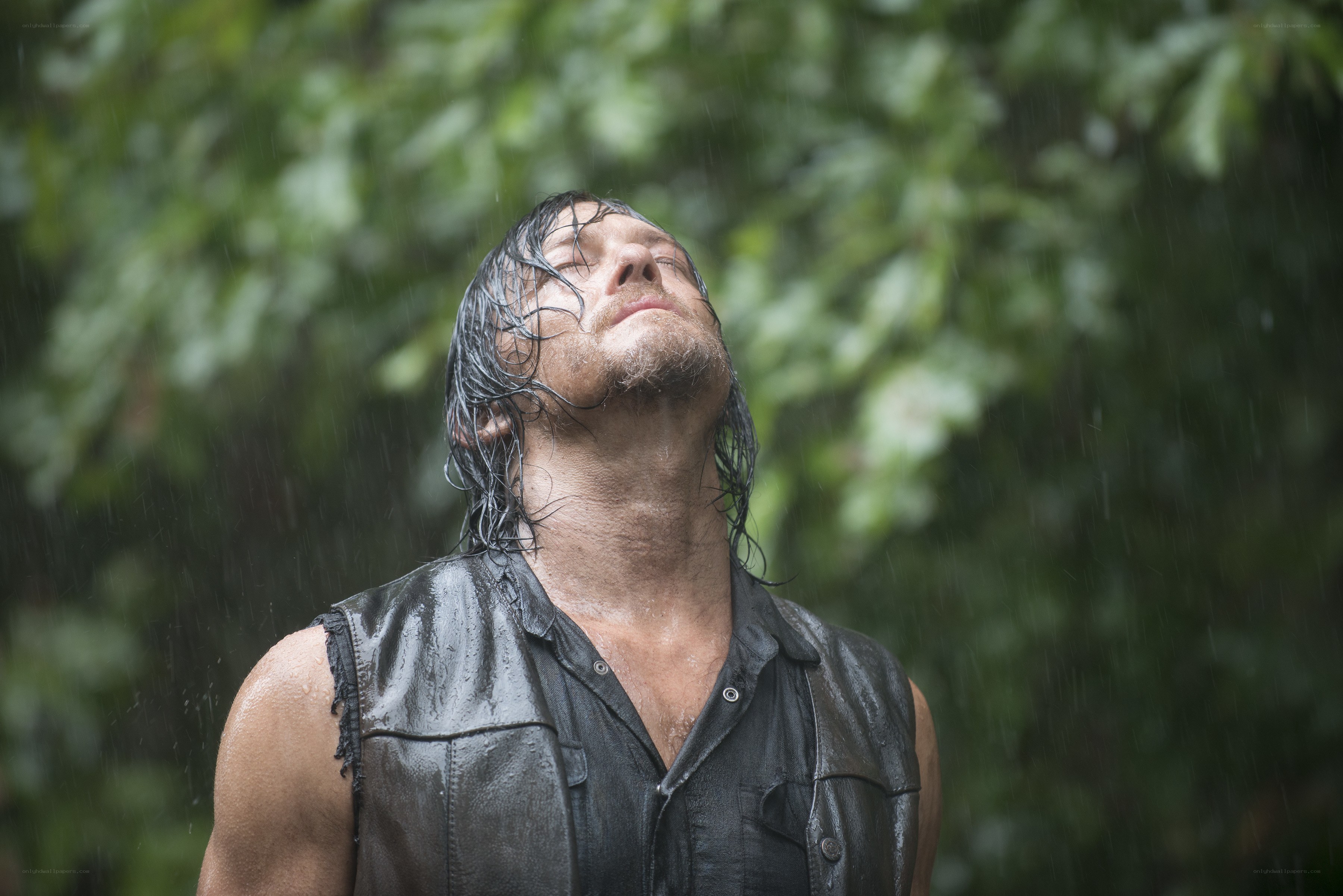 man in rain with eyes closed