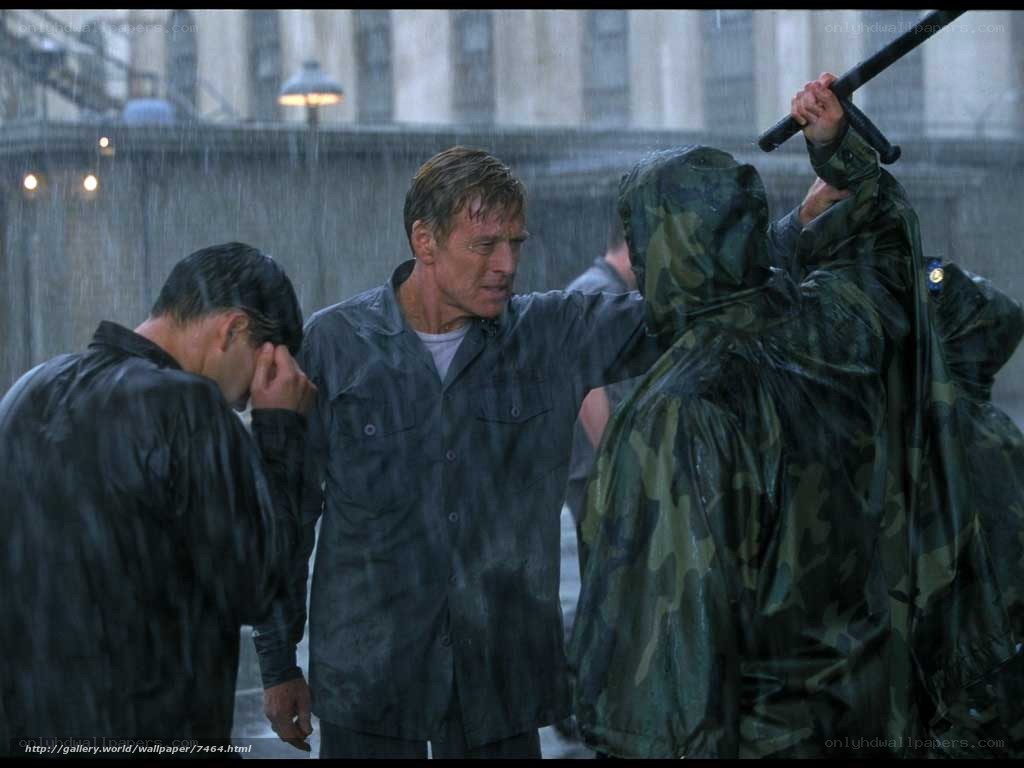 Man in rain with soldiers