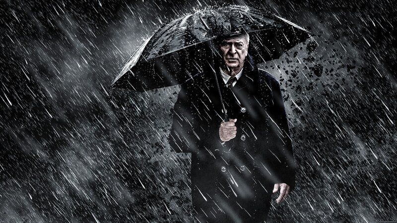 man in rain with umbrella