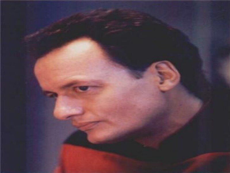 Man in Red and Black Uniform — Serious