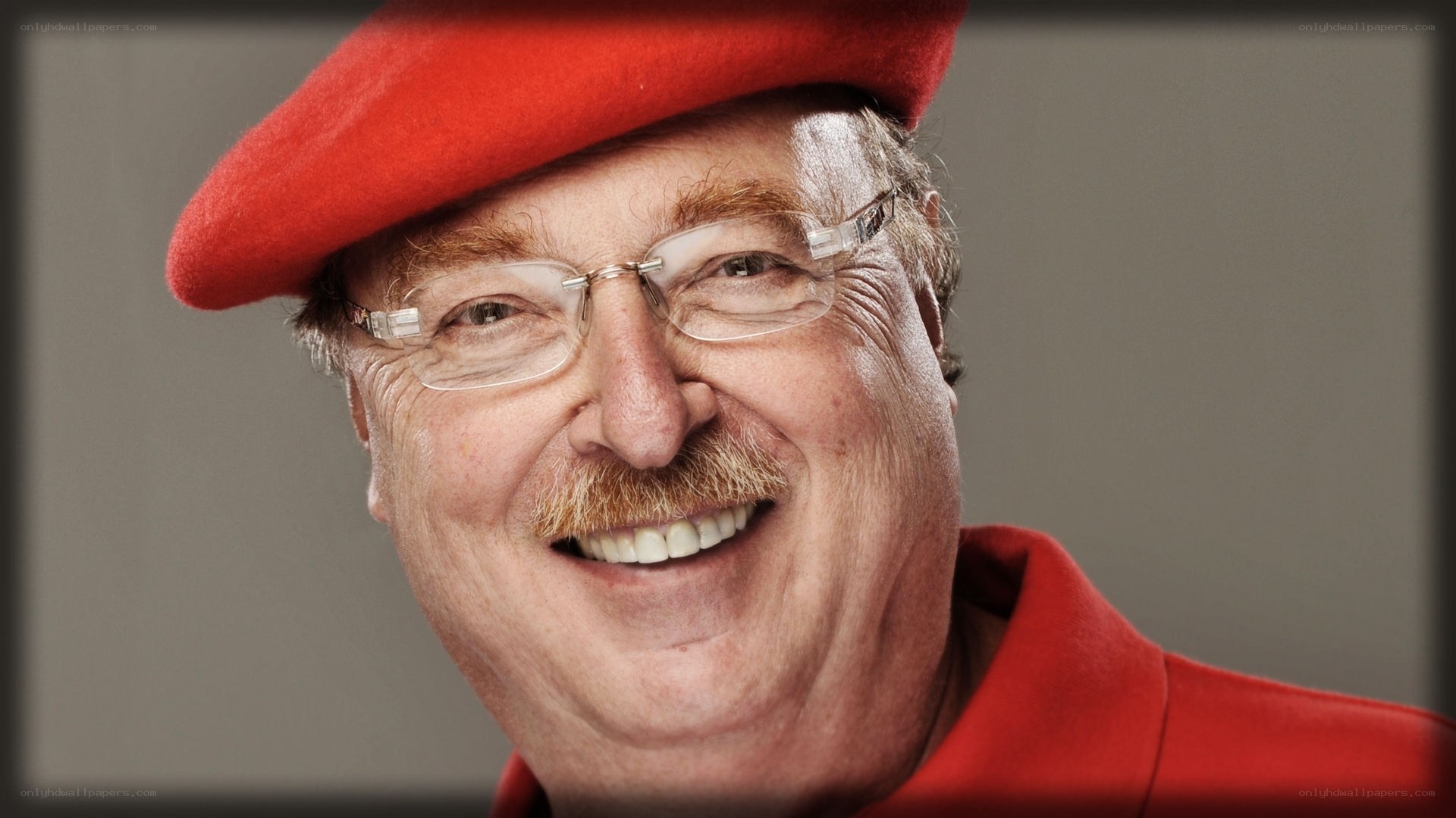 man in red beret smiling