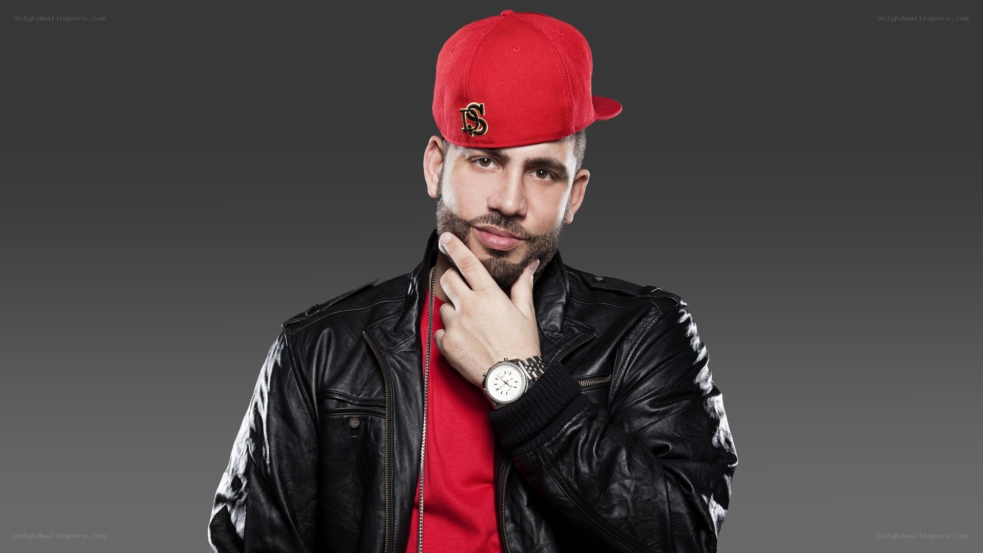 man in red cap and leather jacket
