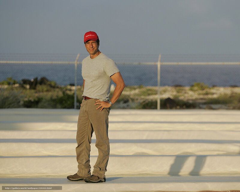 Man in red cap by the sea
