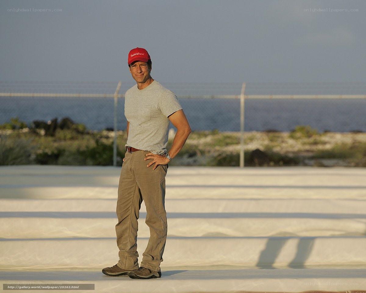 Man in red cap by the sea