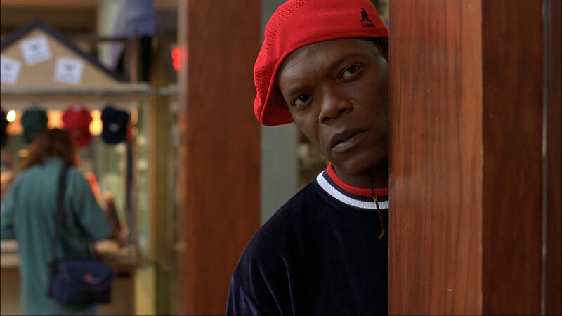 man in red cap peeking