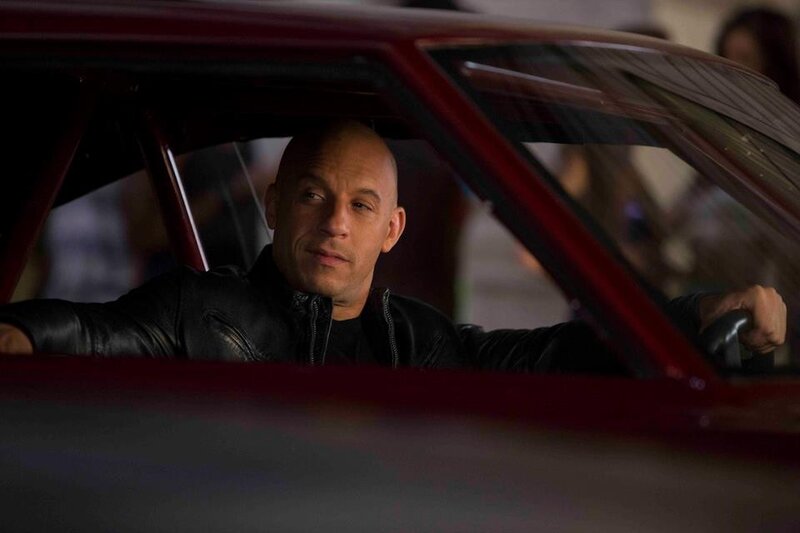 man in red car