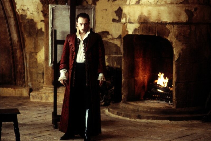Man in Red Coat — Dramatic, Photograph, Fireplace