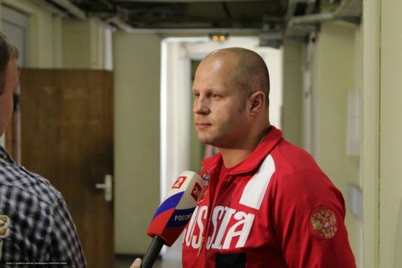man in red jacket being interviewed