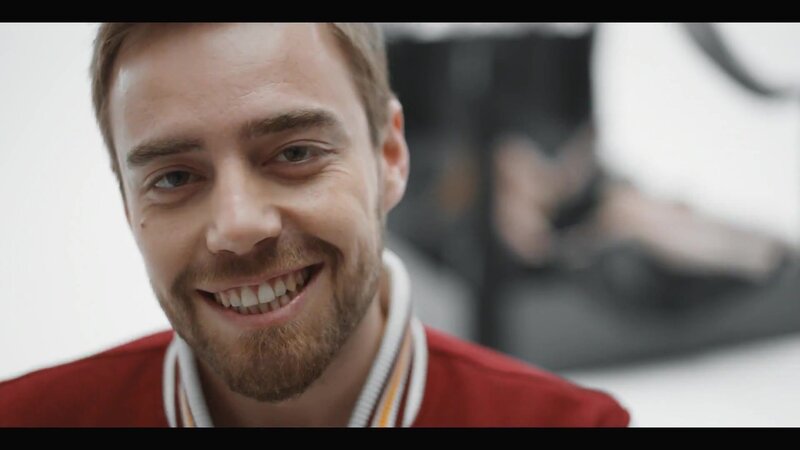 man in red jacket smiling
