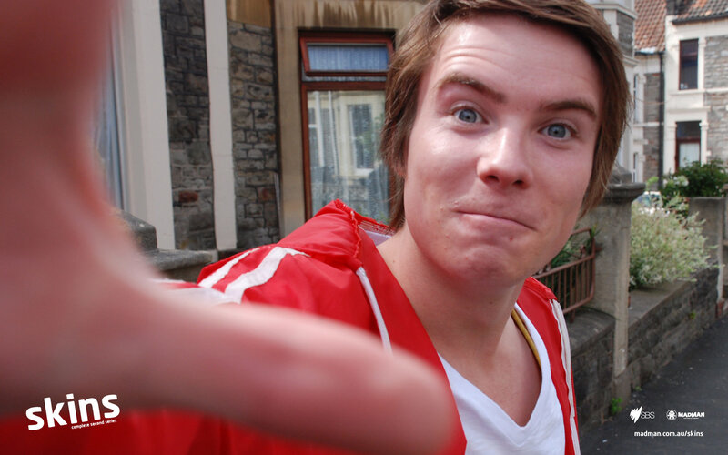 man in red jacket taking selfie