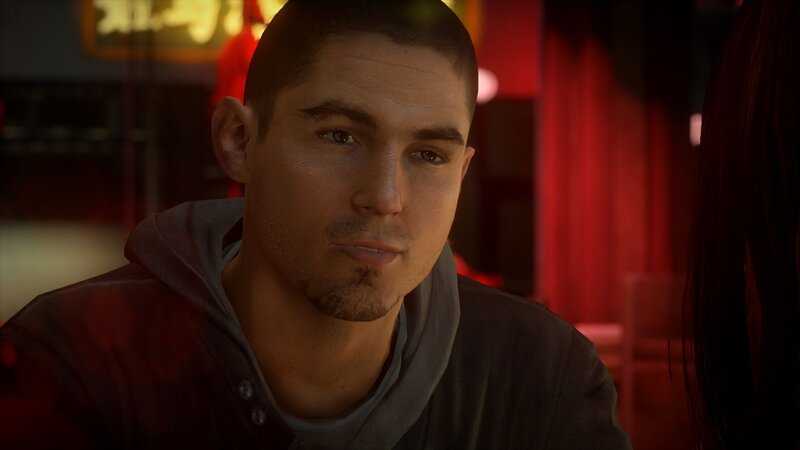 man in red-lit room