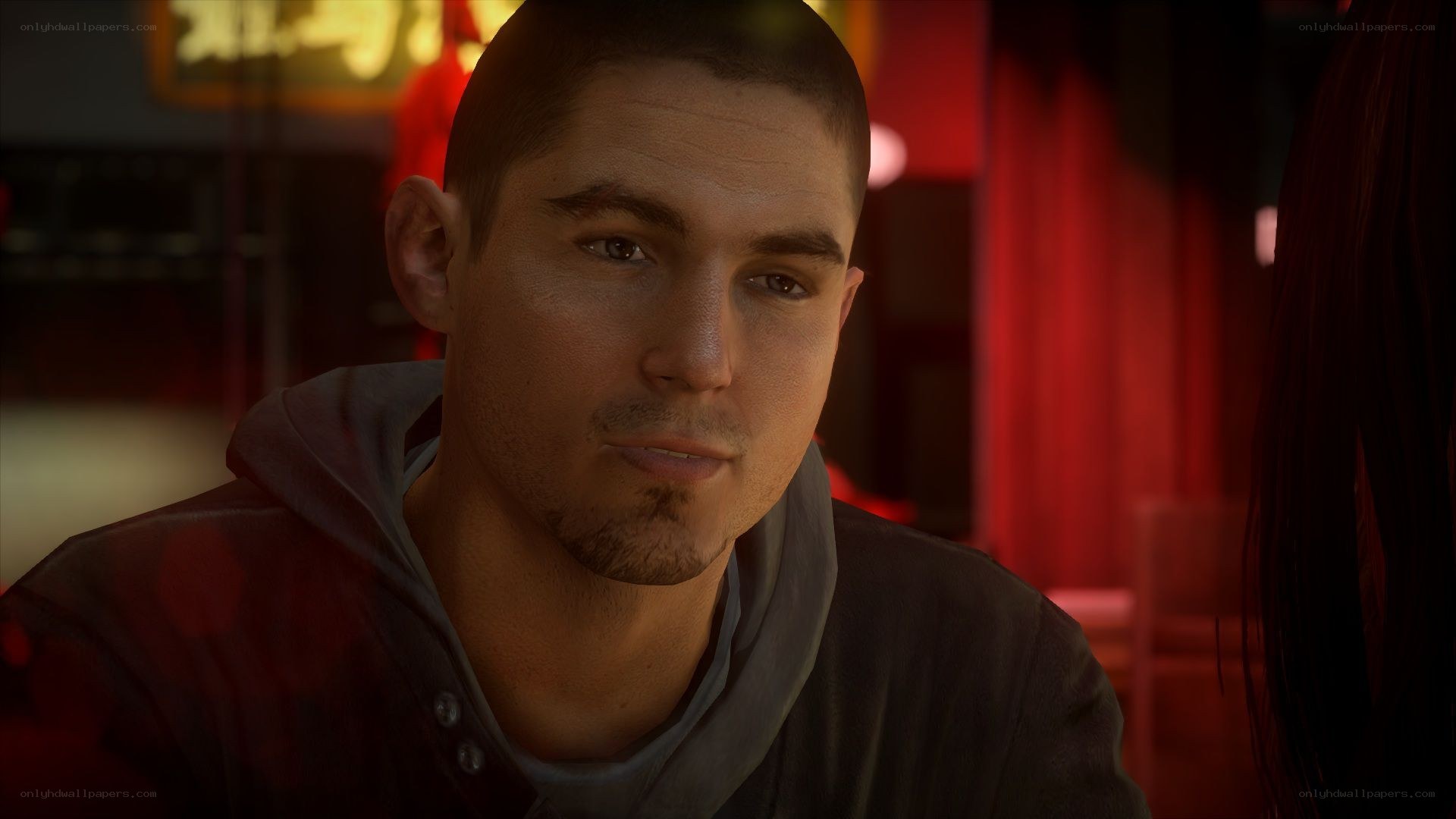 man in red-lit room