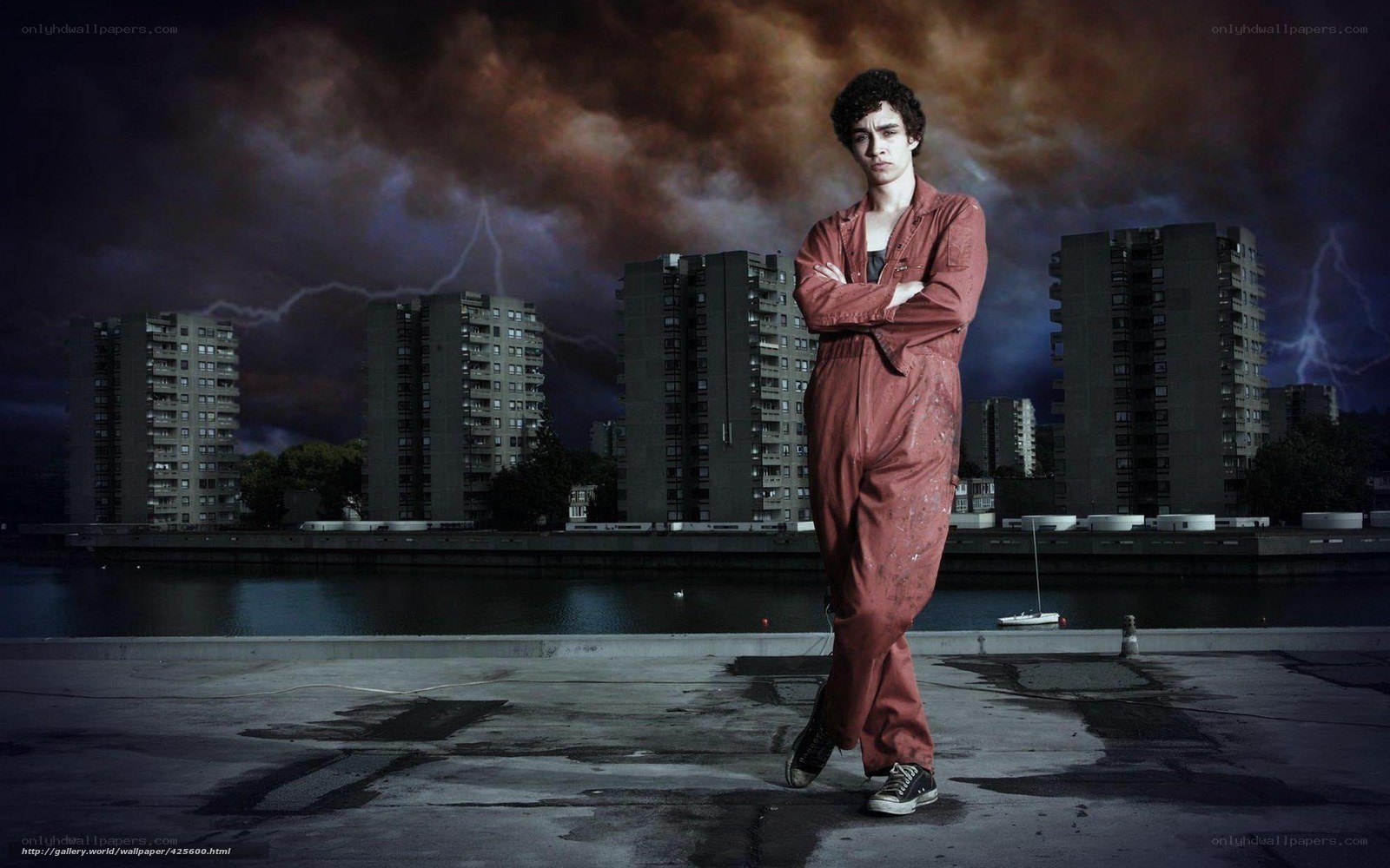 man in red overalls on rooftop