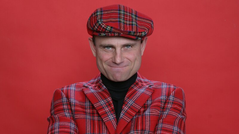 man in red plaid outfit