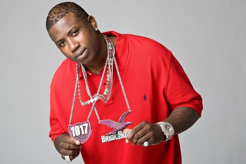 Man in red polo with jewelry