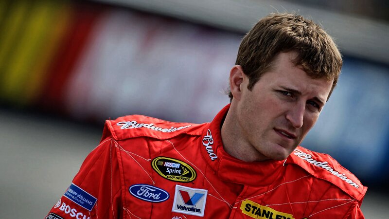 Man in Red Racing Suit — Focused