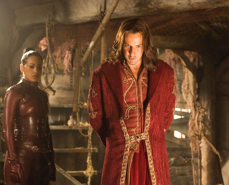 Man in red robe with woman