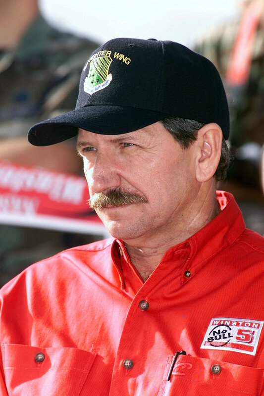 man in red shirt and cap
