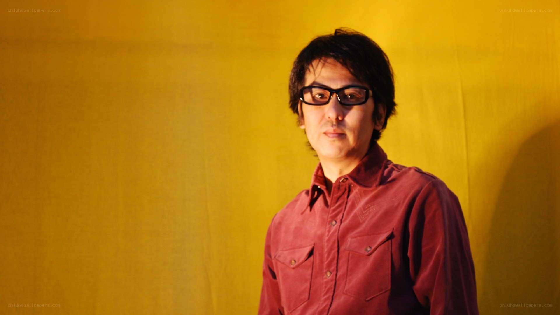 man in red shirt and glasses