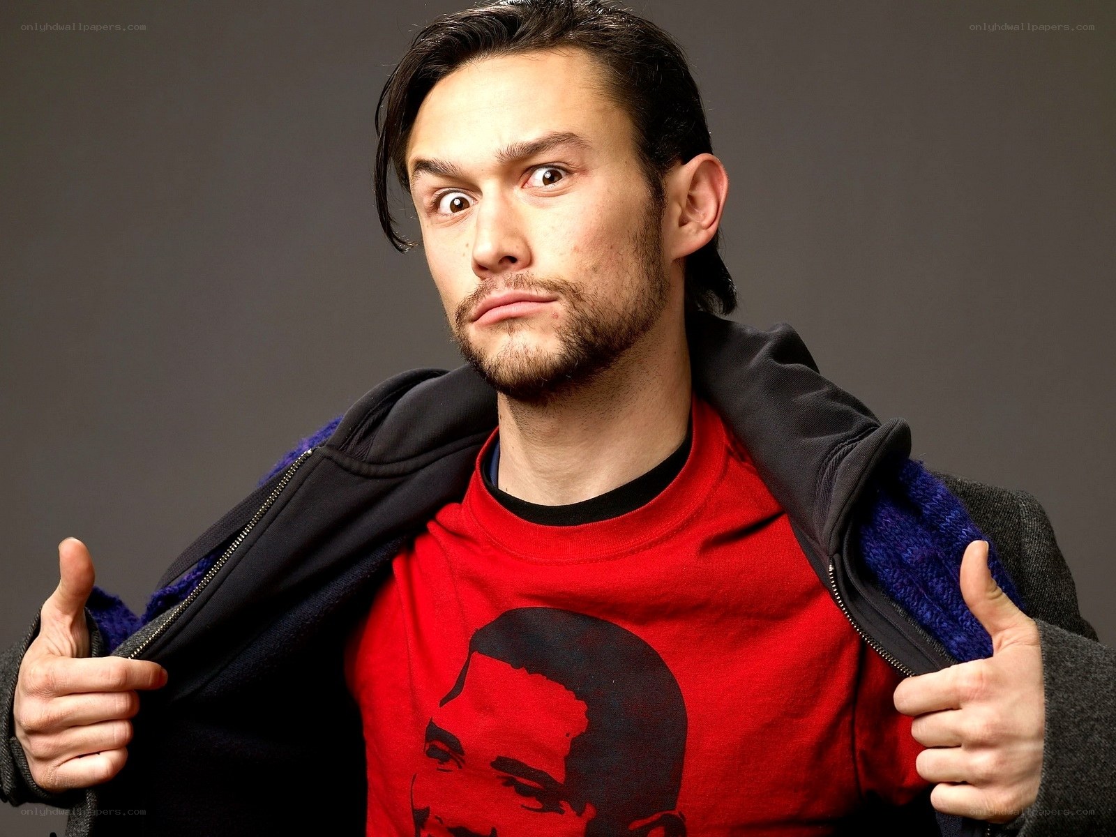 man in red shirt posing