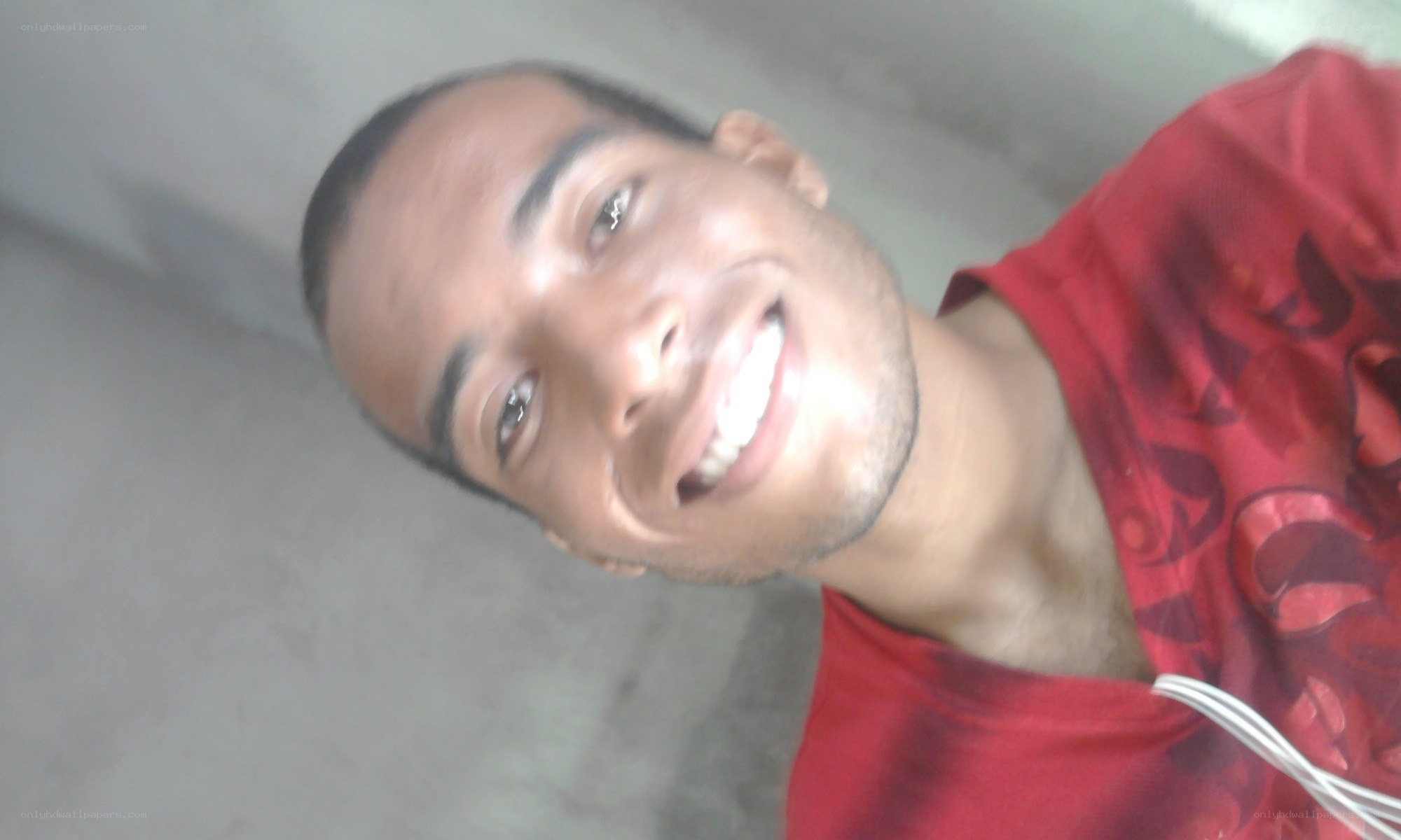 man in red shirt smiling