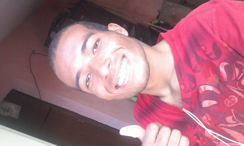 man in red shirt smiling
