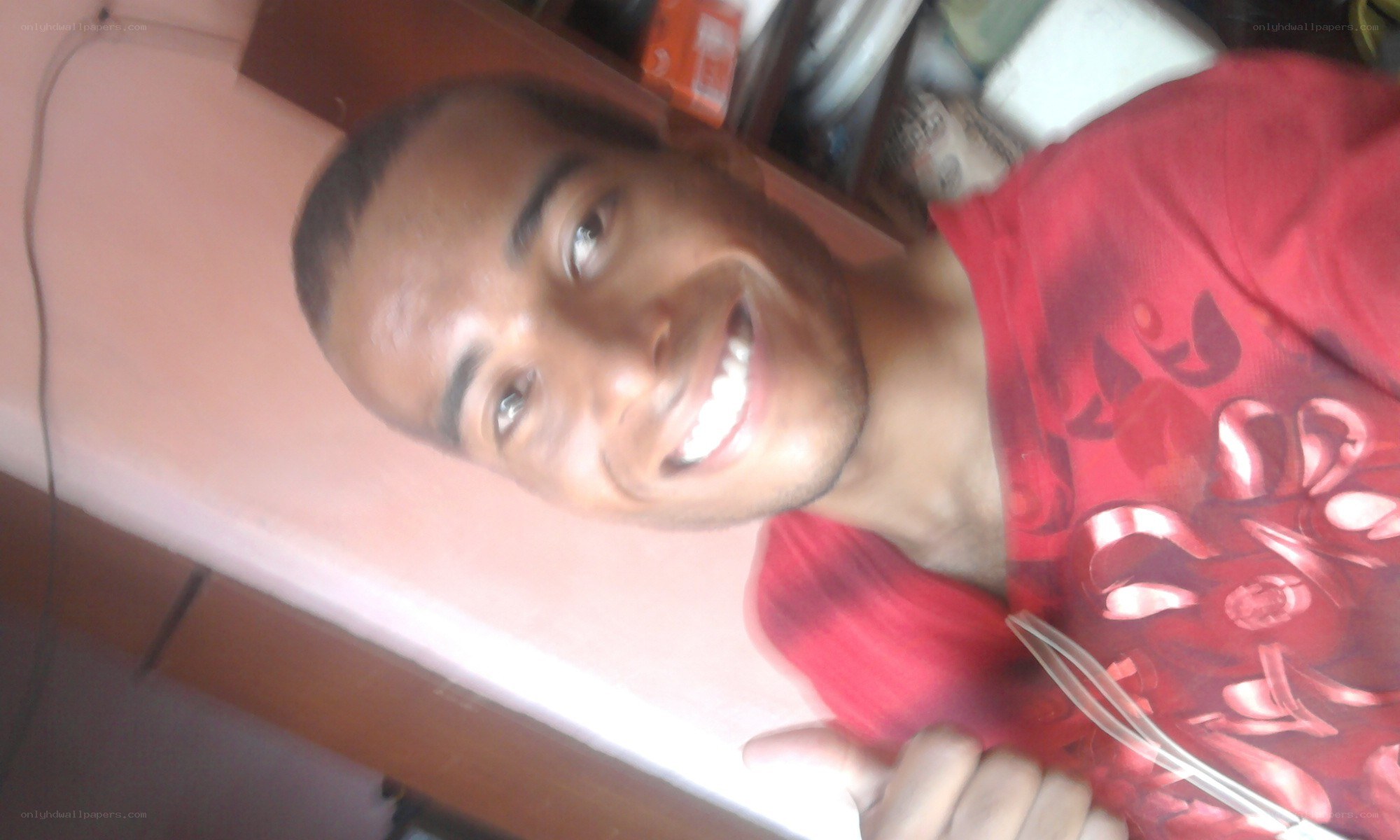 man in red shirt smiling